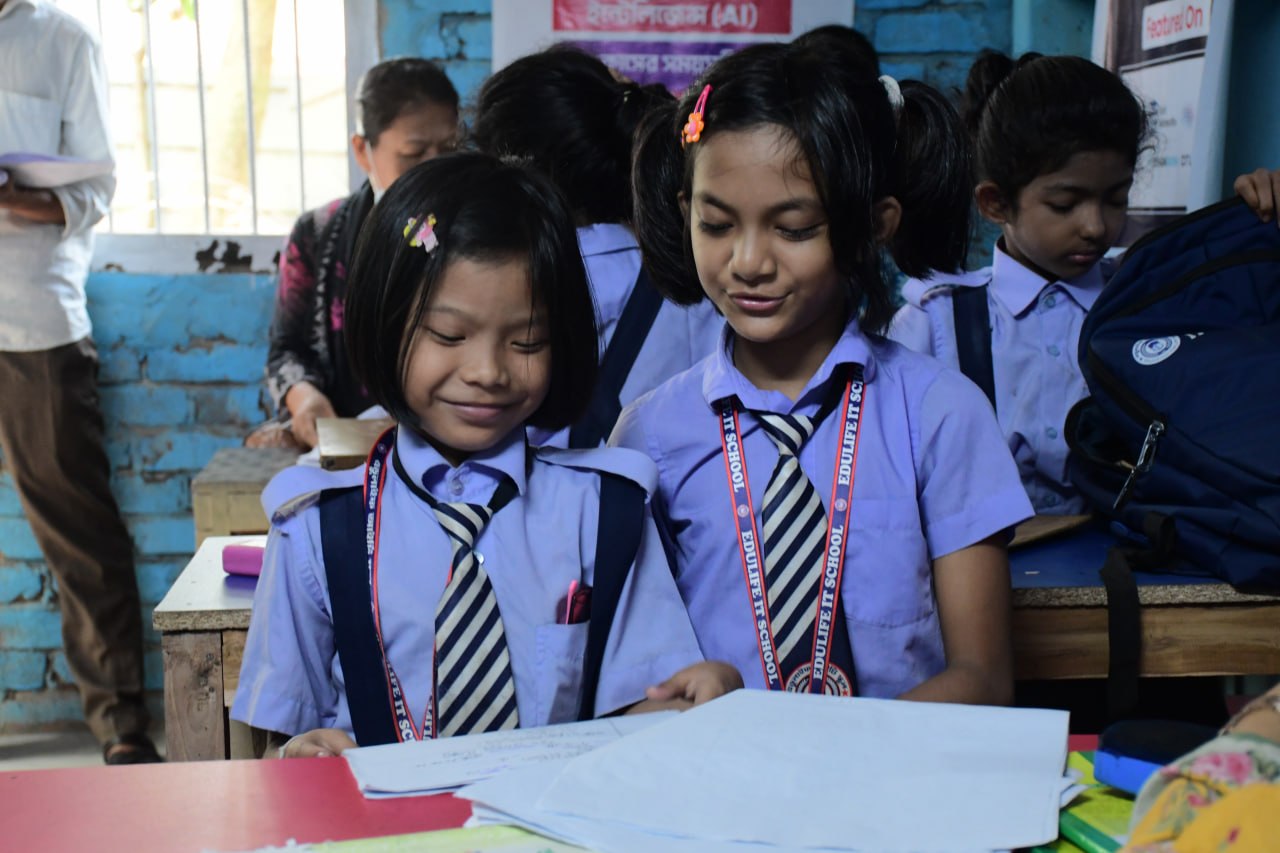 Students learning together in a bright classroom